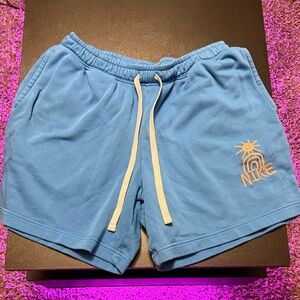 Nike Light Blue Shorts with Orange Graphic